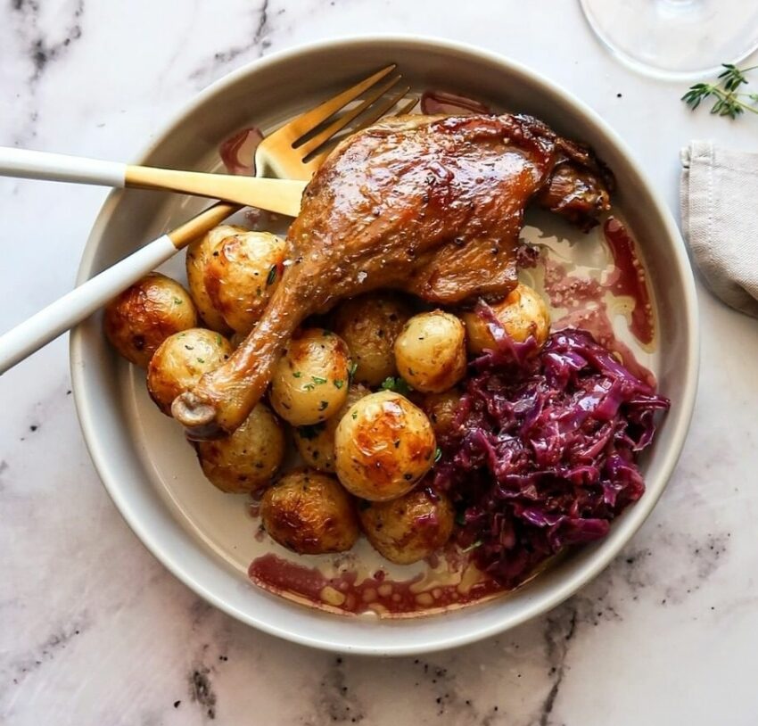 DUCK CONFIT, DUCK FAT CRISPY POTATOES AND BRAISED RED CABBAGE