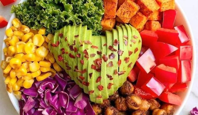 Big heart salad bowl with roasted chickpeas