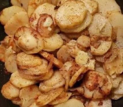 FRIED POTATOES ONIONS AND SMOKE POLISH SAUSAGE