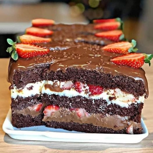 Moist chocolate cake stuffed with strawberries and condensed milk
